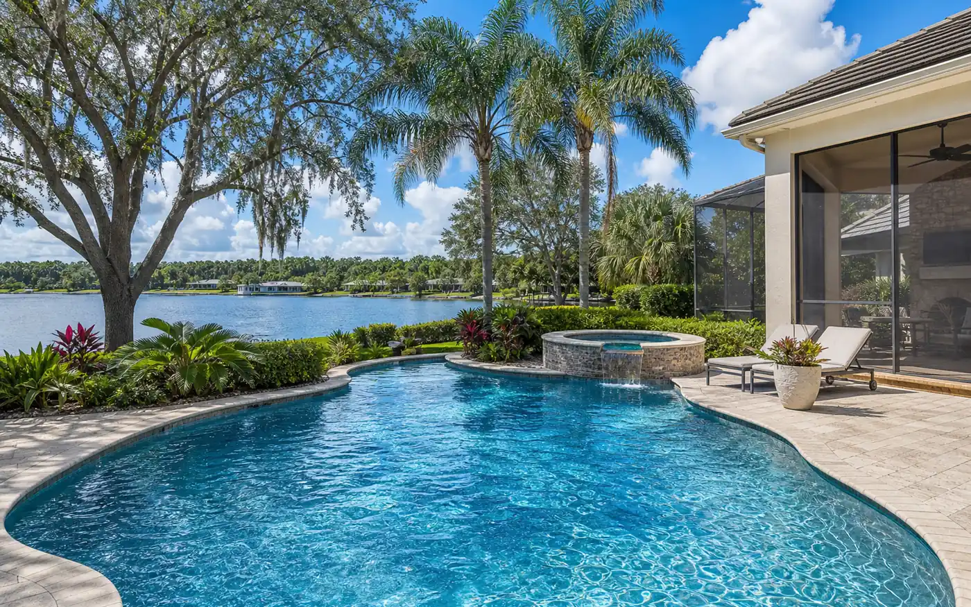 Orlando, FL residential backyard pool with regionally specific landscaping.